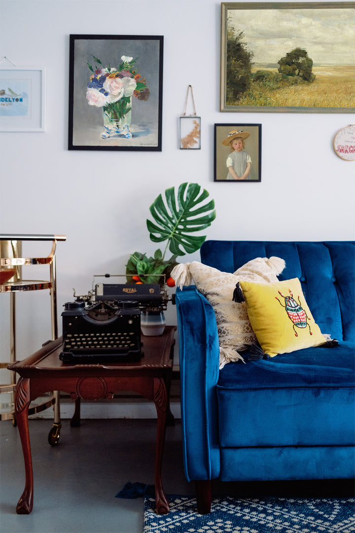 gallery wall featuring vase of flowers vintage print
