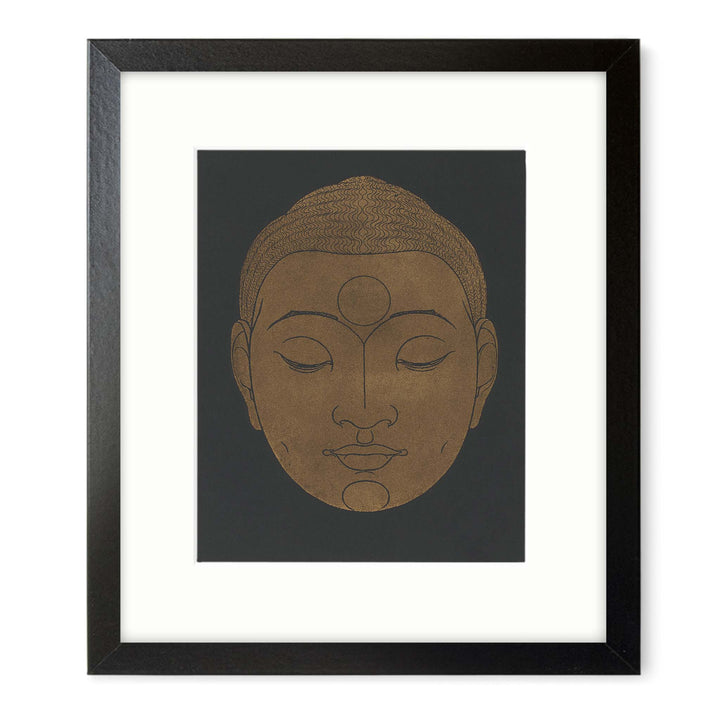 image of a Buddha head in beige on a black background