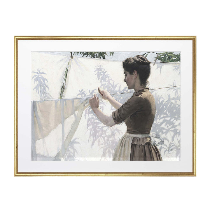 Portrait of a woman hanging out laundry with shaddows on the sheets