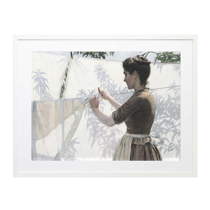 Portrait of a woman hanging out laundry with shaddows on the sheets